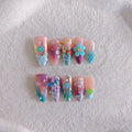 Handmade colourful manicure sculptures with floral butterfly designs for almond-shaped nails