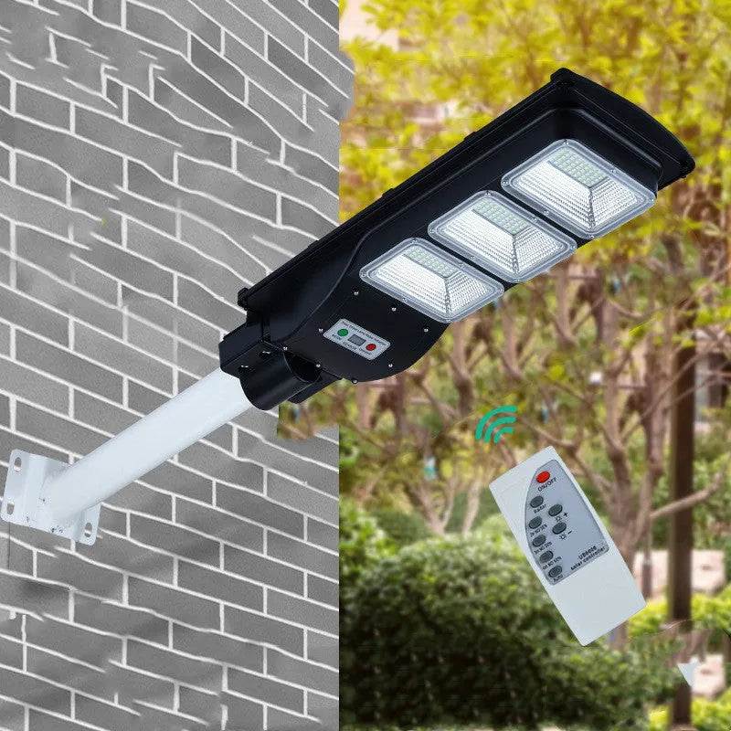 Integrated solar street light unit with solar panel and LED light in one housing