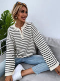 Black and white striped women's casual top with contrast colour detailing and drop-shoulder sleeves