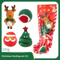 Christmas-themed vinyl dog chew toy set including barbells, balls, ropes, and festive figures in gift packaging.
