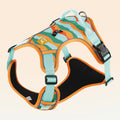 Orange reflective dog chest and back harness with an attached hand-holding rope on a grey background.