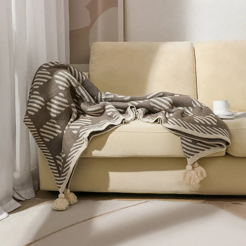 Bohemian-style acrylic sofa blanket with tassel edges in geometric pattern or solid colour options