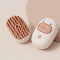 White rechargeable pet steam brush with rubber teeth and water tank for dogs and cats