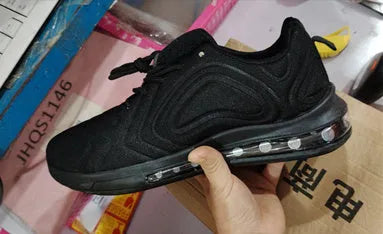 Men's black casual sneakers with a thick sole and lace-up design.