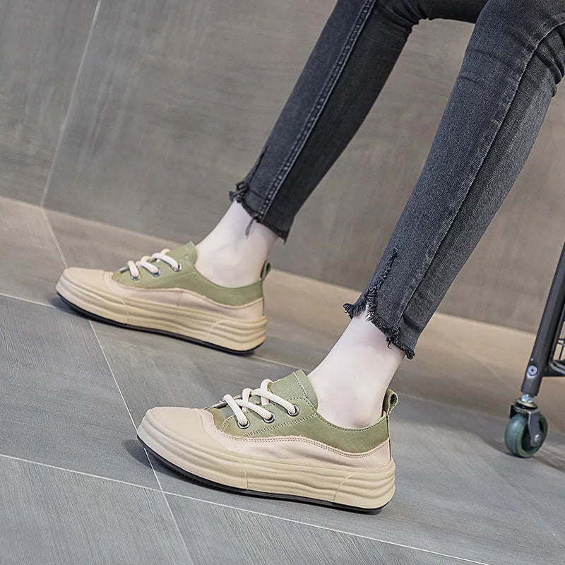 Women's leather low-top platform sneakers in matcha green on a white background.