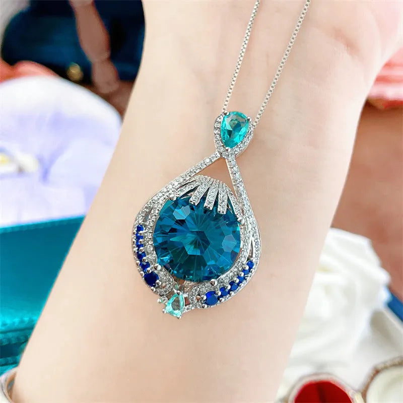 Blue geometric women's necklace with fireworks cut gems on water wave chain