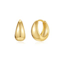 A pair of simple geometric brass earclip earrings with a round element and electroplated golden finish.