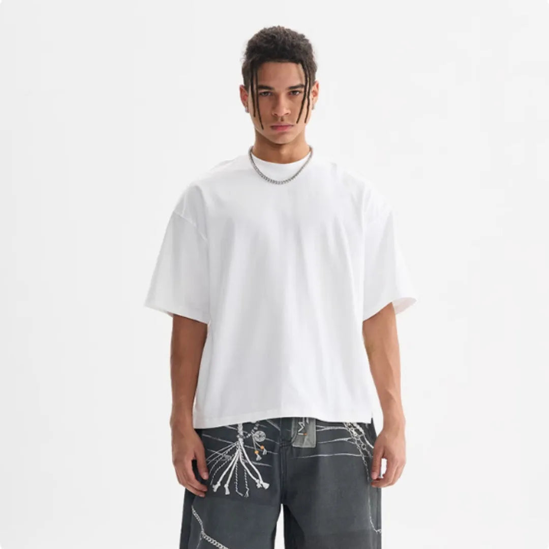 Man wearing a loose fit apricot coloured pure cotton t-shirt, short sleeves, casual American style.
