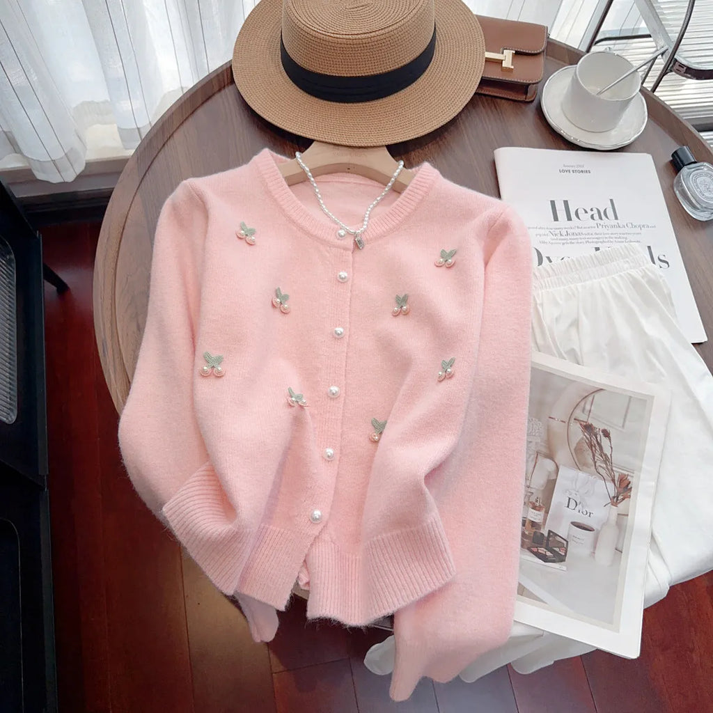 Pink nylon cashmere slim fit cardigan coat with beaded details and a round neck.