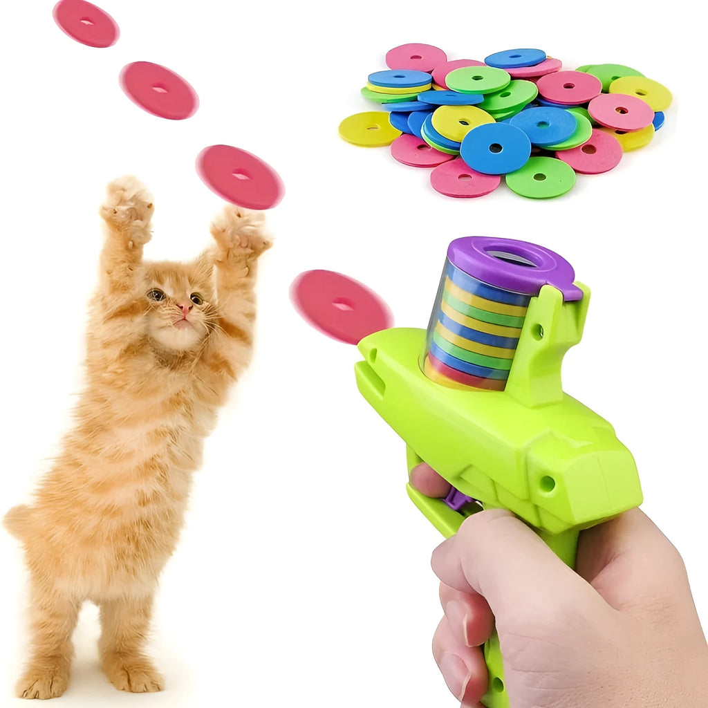Interactive cat toy launcher firing foam disc with green plastic construction