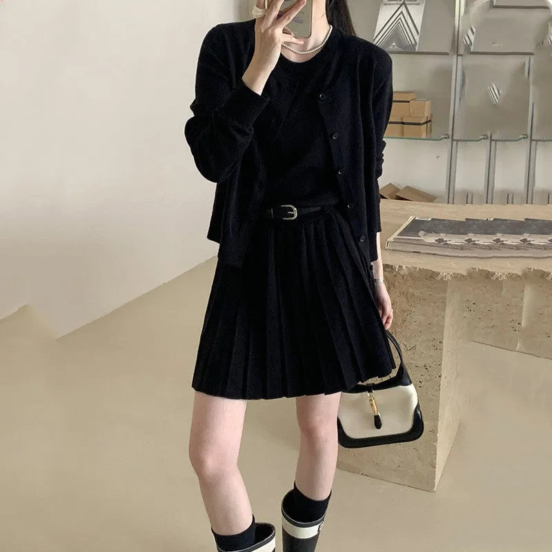 Women's grey national style knitted two-piece set with pleated vest skirt and long-sleeved cardigan.