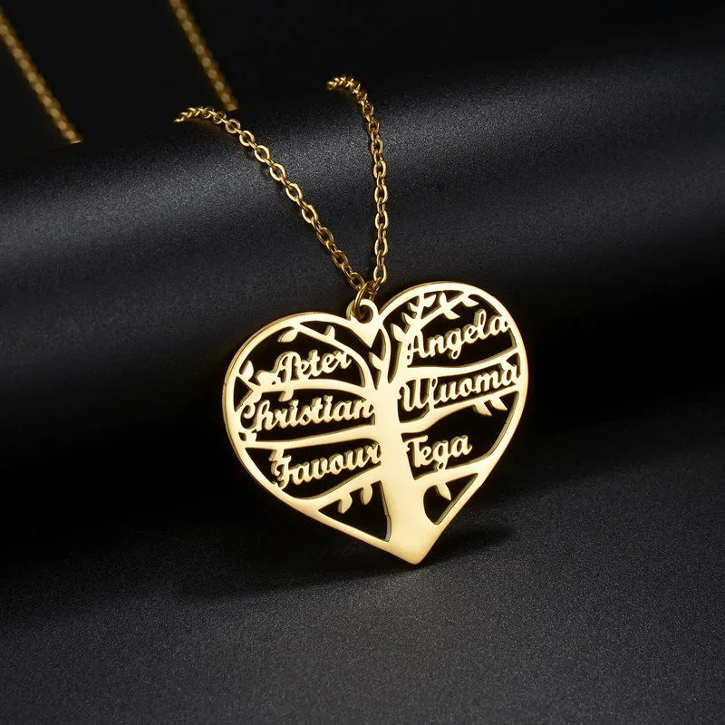 Women's custom name necklace with stainless steel heart and tree pendant on a chain.
