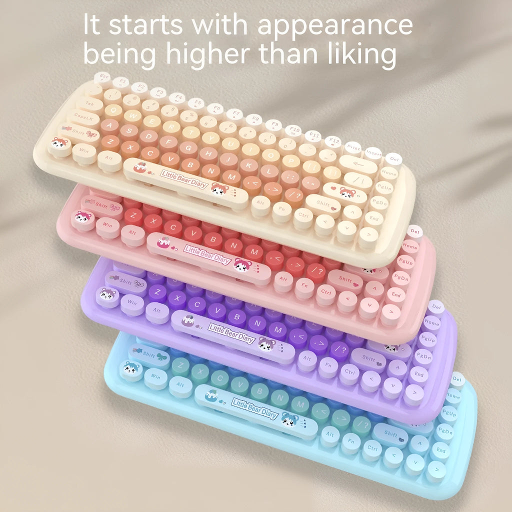 Pink miniature cartoon wireless keyboard and mouse set with USB receiver on desk