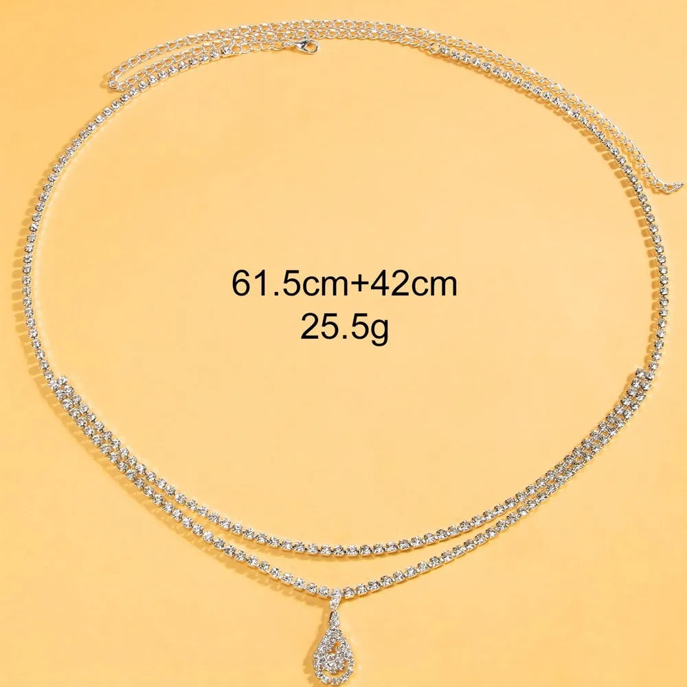 Gold or silver women's waist chain with water drop rhinestone pendant and tassel, 115cm long.