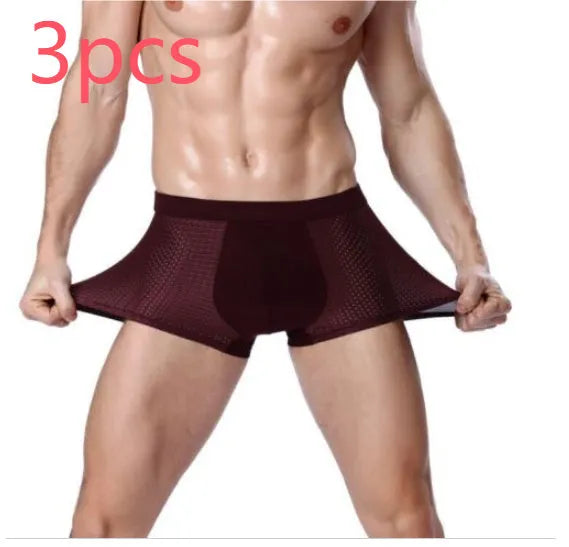 Men's solid colour modal boxer briefs with U convex design on a mannequin, showing mid-waist fit.