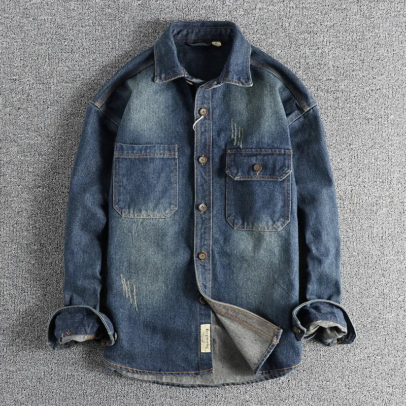 Men's light blue washed vintage denim shirt with long sleeves and a loose cardigan fit.