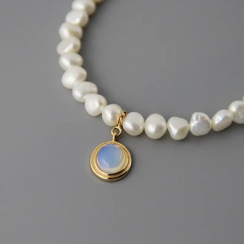 Geometric silver pendant necklace with irregular freshwater pearls on adjustable chain