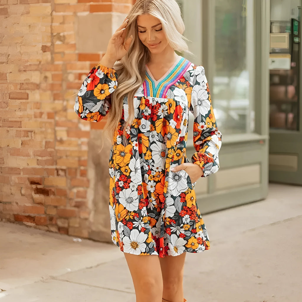 Orange floral print V-neck mini dress with striped lace detailing and long sleeves