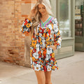 Orange floral print V-neck mini dress with striped lace detailing and long sleeves