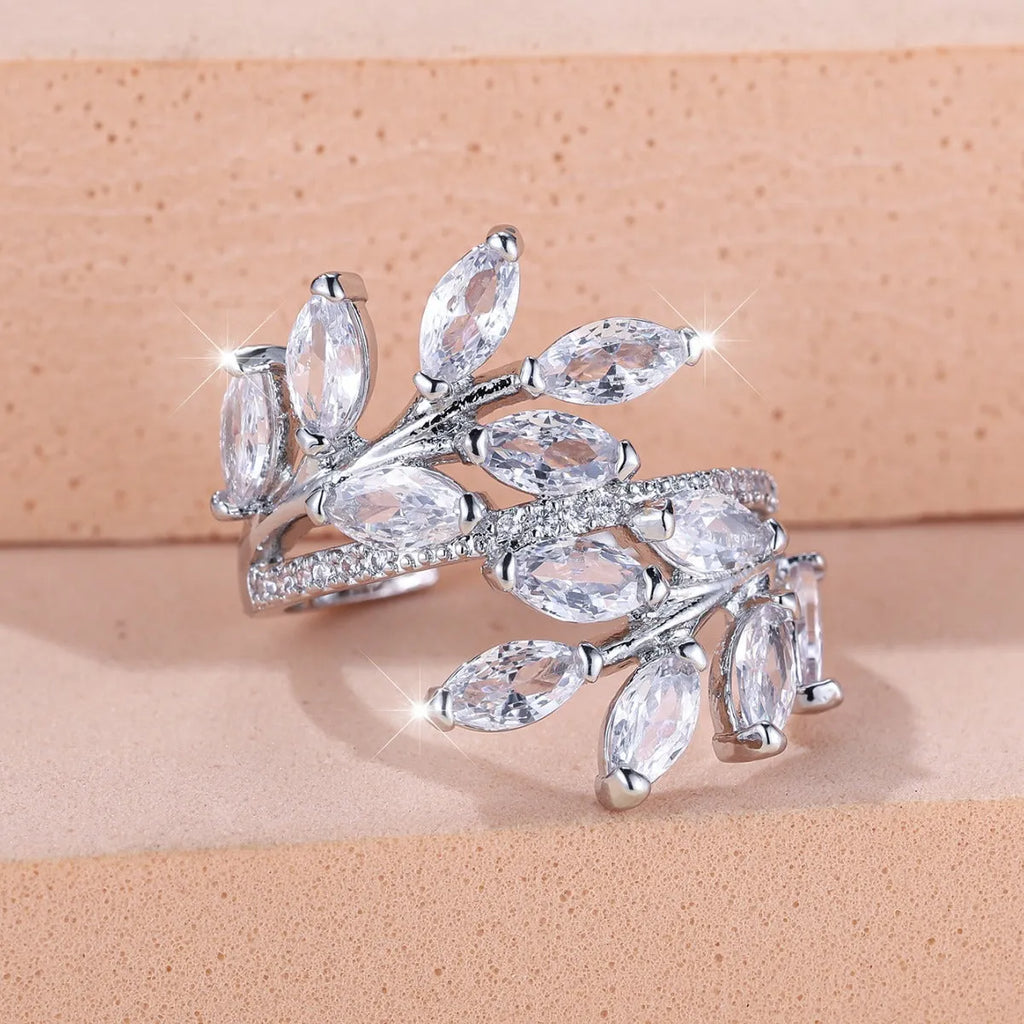 Adjustable copper leaf ring with horse eye zircon accents in multiple colour variations