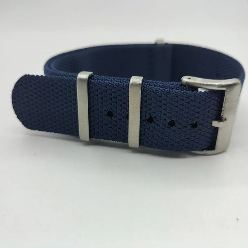 Nylon quick-release watch strap in army green, showing the integrated spring bar mechanism.
