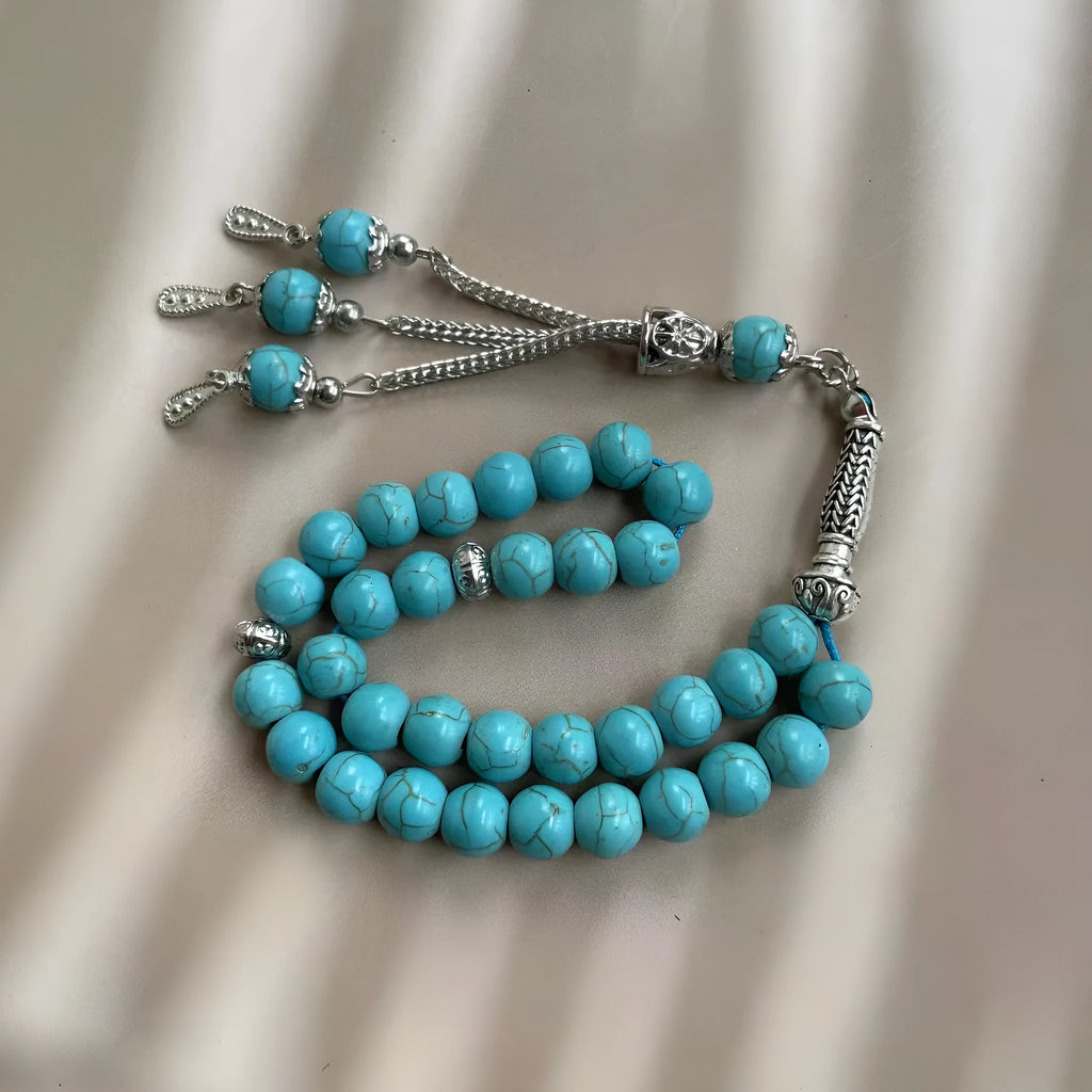 Sky blue natural stone bead Muslim prayer bracelet with 8mm spherical beads on a cord.