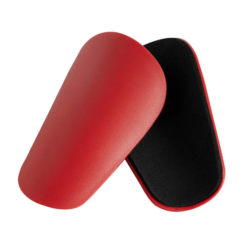 Pair of black PU mini shin guards for sports protection, showing S size.