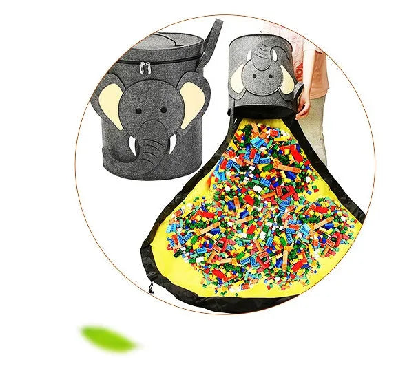 Green felt cube storage bag with a pull rope, laid flat as a play mat.
