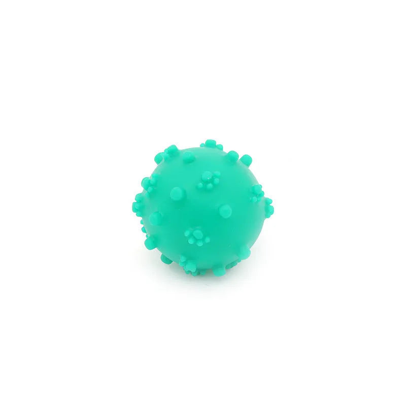 Bright blue, green, pink and yellow spiky dog balls with paw print dimples for small breed chewing and fetch.