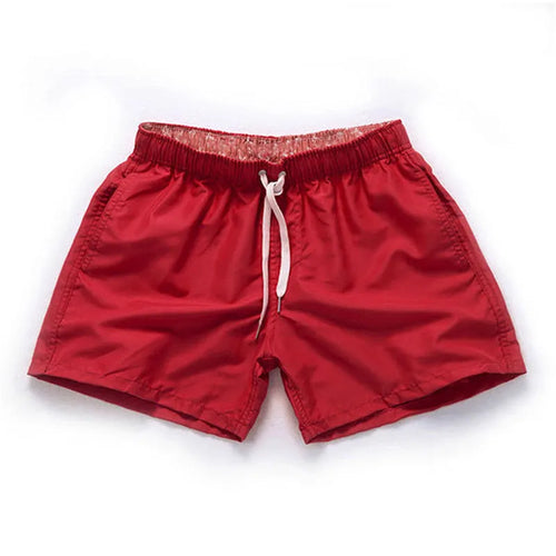 Men's polyester beach shorts with straight leg opening in multiple colours including black, white, and fluorescent yellow