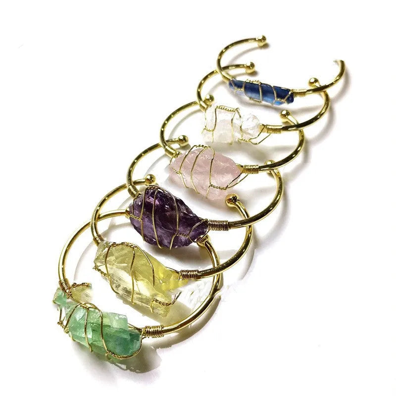 Natural crystal rough stone bracelet with gold winding metal accents in geometric bohemian style