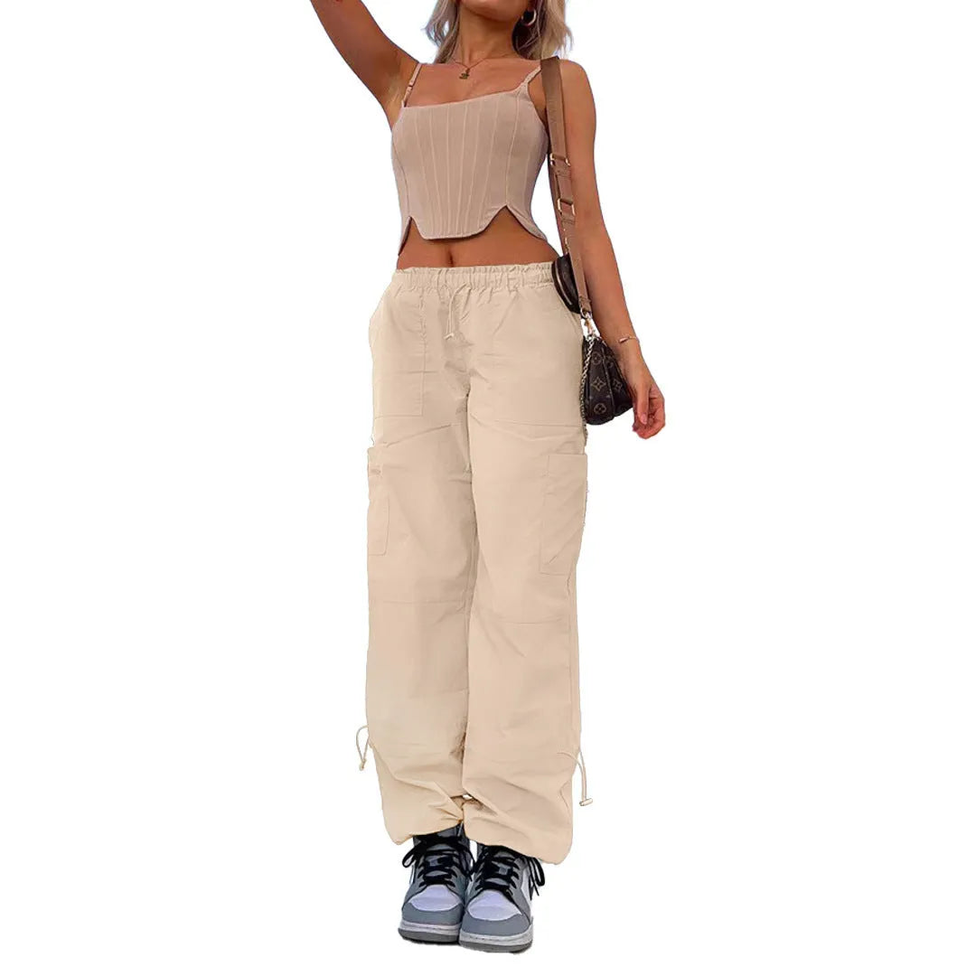 Straight-leg loose fit cargo casual pants in grey with multiple pockets, made from polyester fabric.