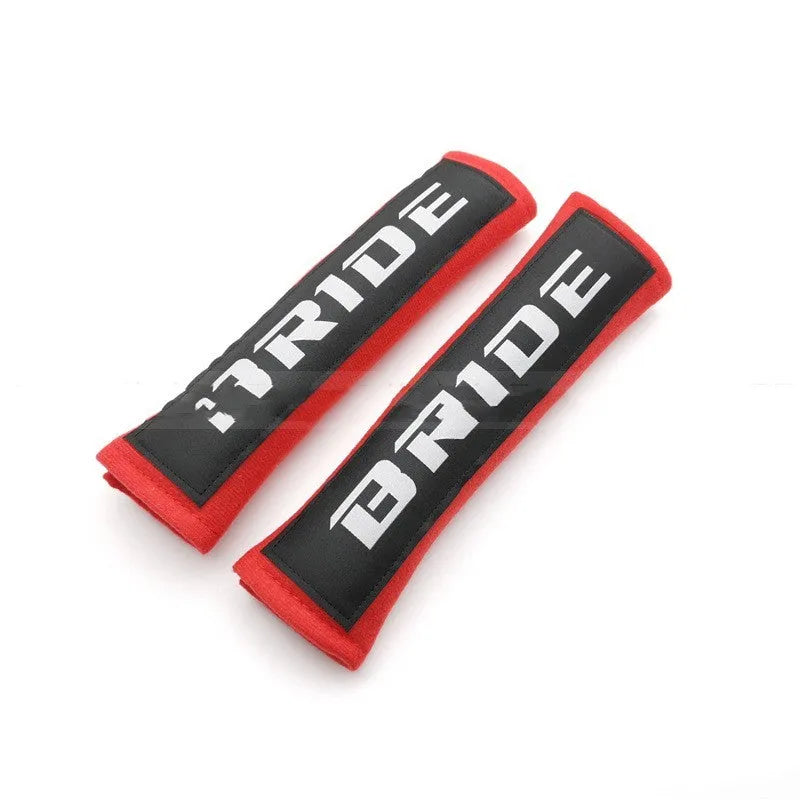 Black cotton sponge cloth car seat belt shoulder pad showing embroidery weaving texture and 22.5cm length