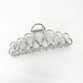 Large gold or silver alloy hair clip with minimalist design and European tassel detailing for women's updo hairstyles