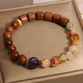 Yellow tower crystal and ebony amethyst bracelet with pearl, rhinestone, and sequin detailing for women