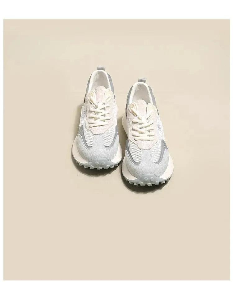 Women's grey retro sneaker with low-top design, mesh lining, and rubber sole