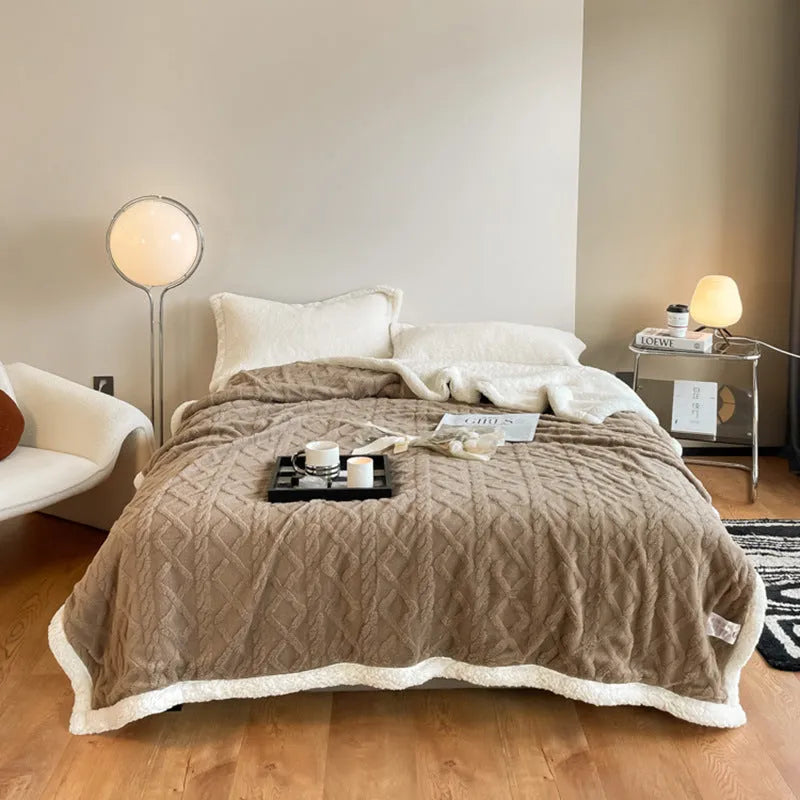 Polyester thermal flannel blanket in beige, folded to show texture and size.