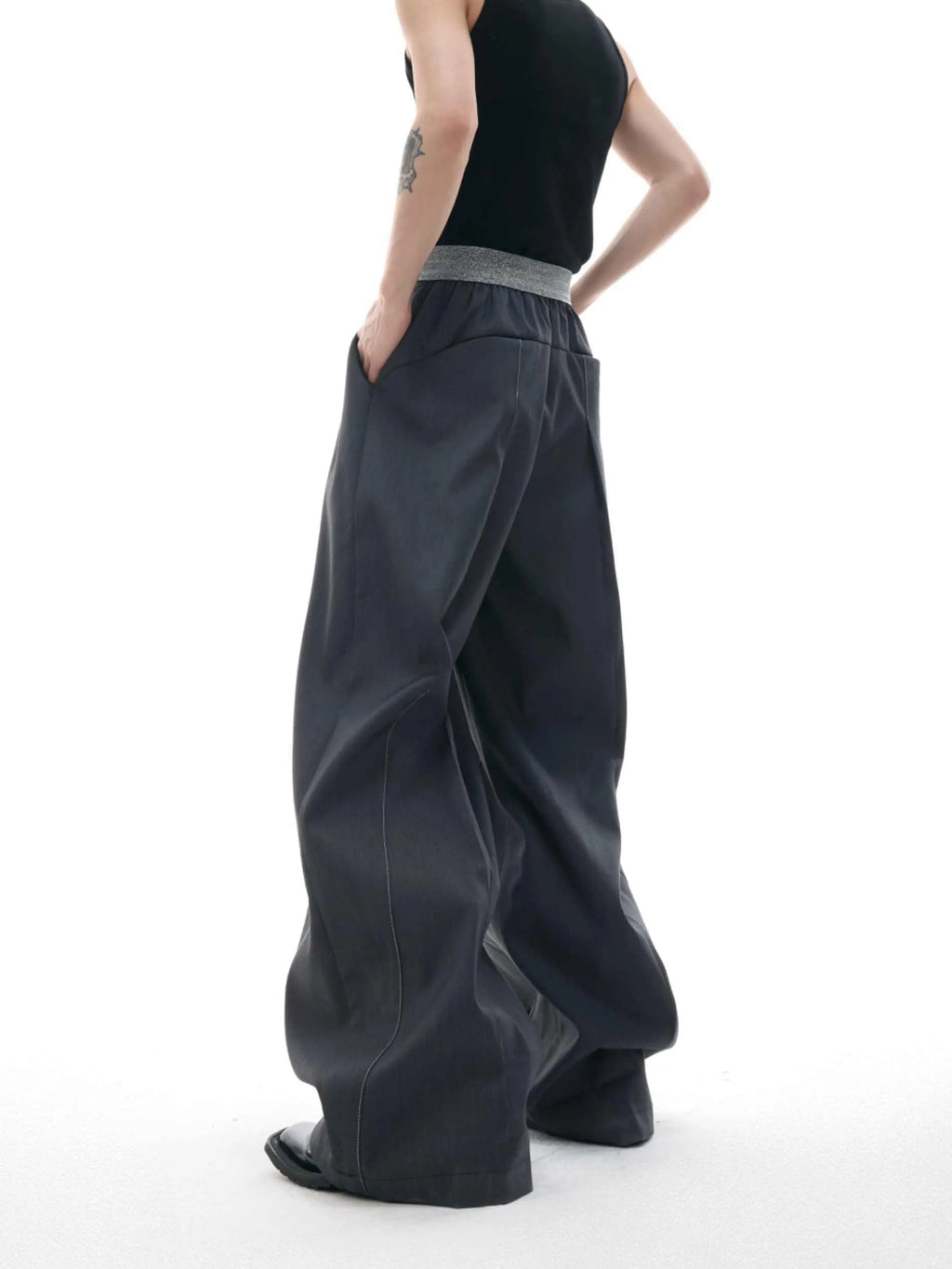 Straight-leg high-waist trousers with button open line detailing in black and grey colours
