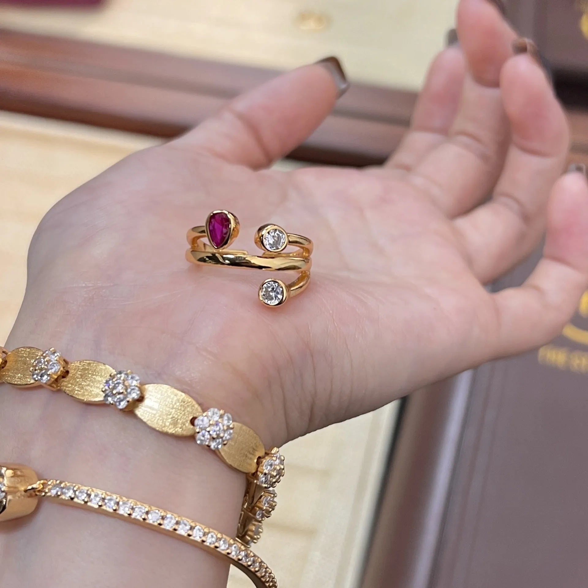 Irregular cross geometric ring with double-headed diamonds and two-tone colour finish