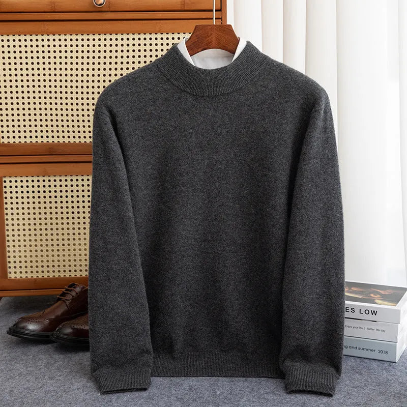 Man wearing a loose-fit half-collar wool sweater in a dark colour, showcasing the knitted texture and neckline design.