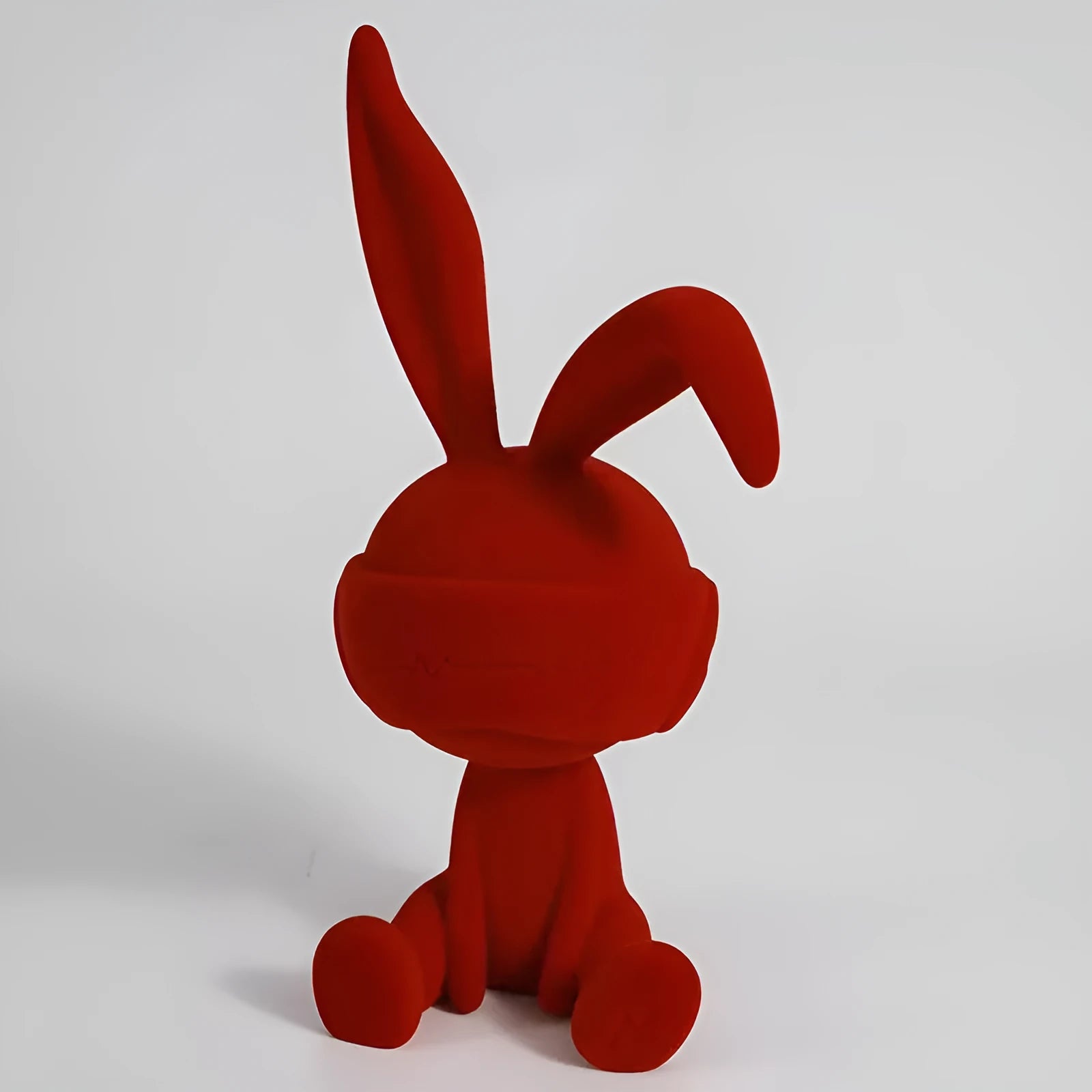 Blue resin rabbit table ornament with suede blindfold decorative detail