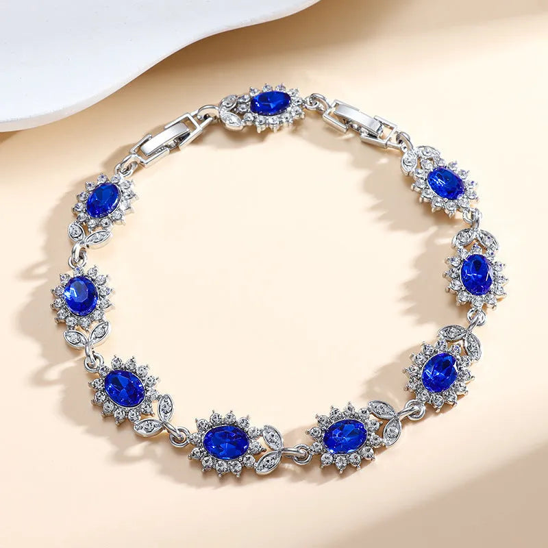 Women's bracelet with inlaid zircon gemstones in multiple colours on environmentally friendly alloy band