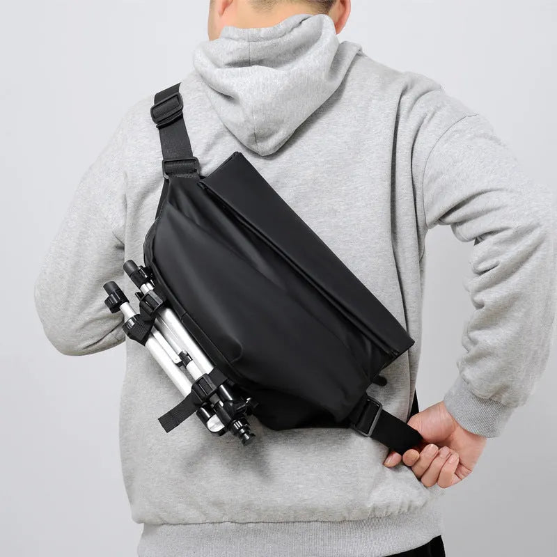 Grey PU crossbody bag with single adjustable shoulder strap showing interior phone pocket