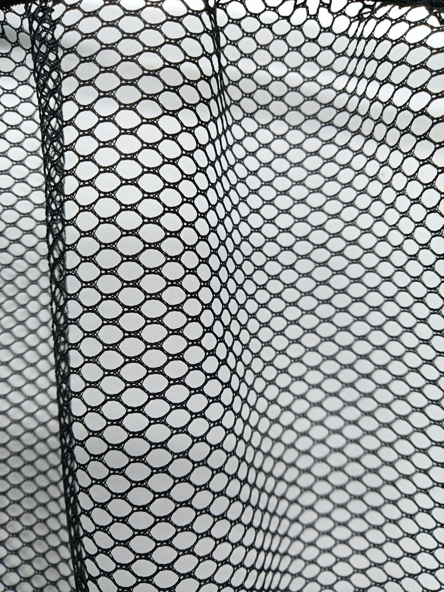 Elastic polyester car boot storage net shown in 20x45cm size securing loose items.