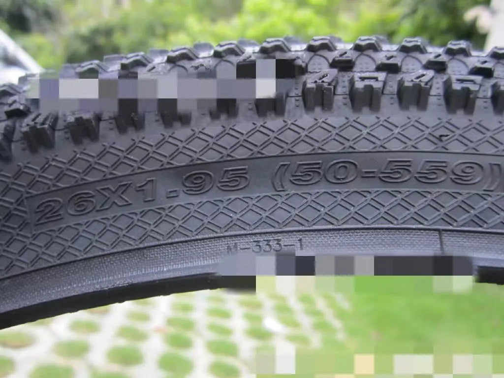 Ultralight puncture-proof mountain bike tyre shown in black with aggressive tread pattern.