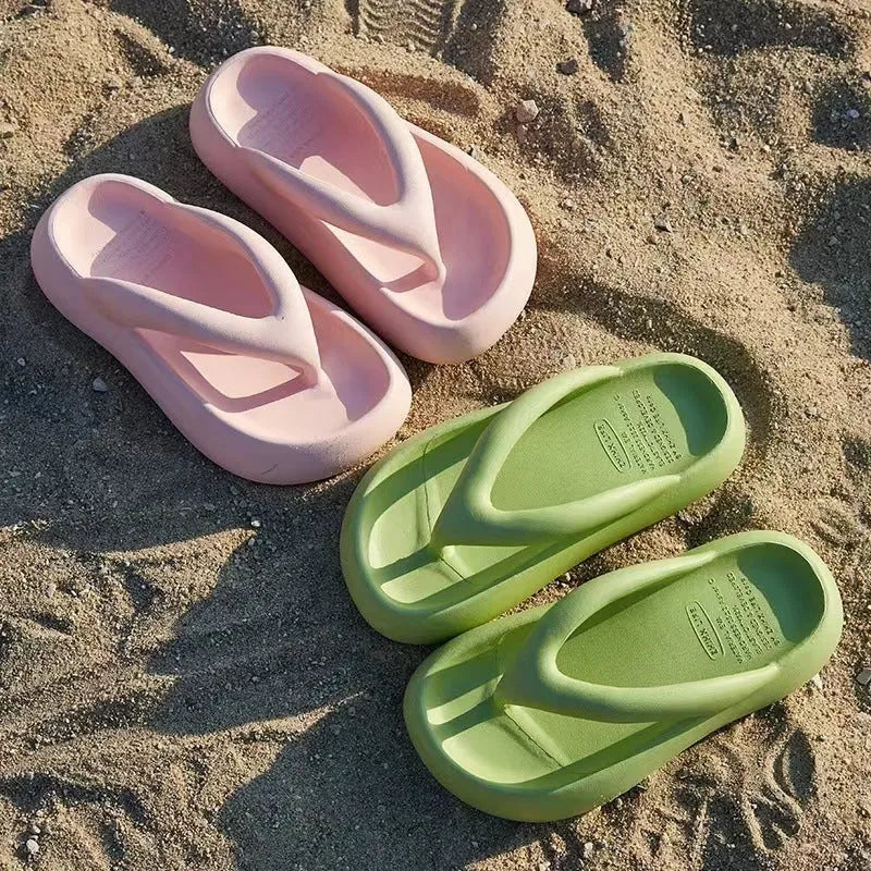Solid colour women's flip-flops with a thick sole, decorative bow, and thong strap.