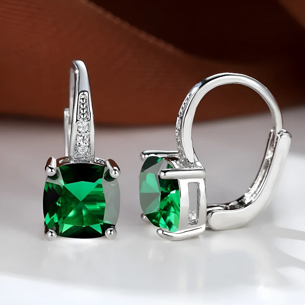 Square geometric ear hook earrings with zircon stones in an electroplated copper setting.