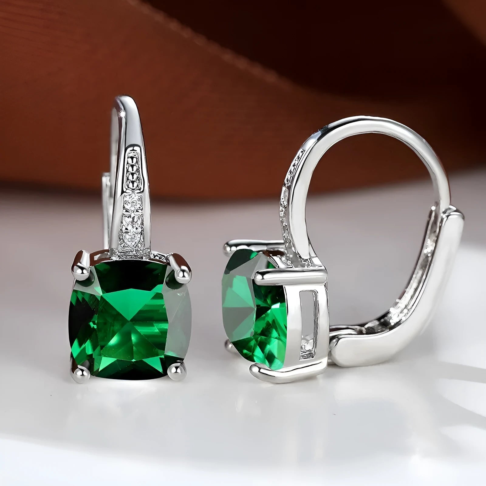 Square geometric ear hook earrings with zircon stones in an electroplated copper setting.