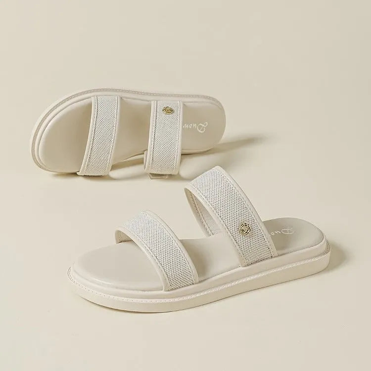 Women's brown retro soft bottom flip-flops with an artificial PU upper on a plain background.