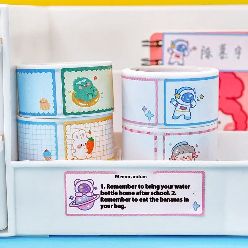 Roll of cartoon name tape stickers showing dinosaur, astronaut, rabbit and girl theme designs